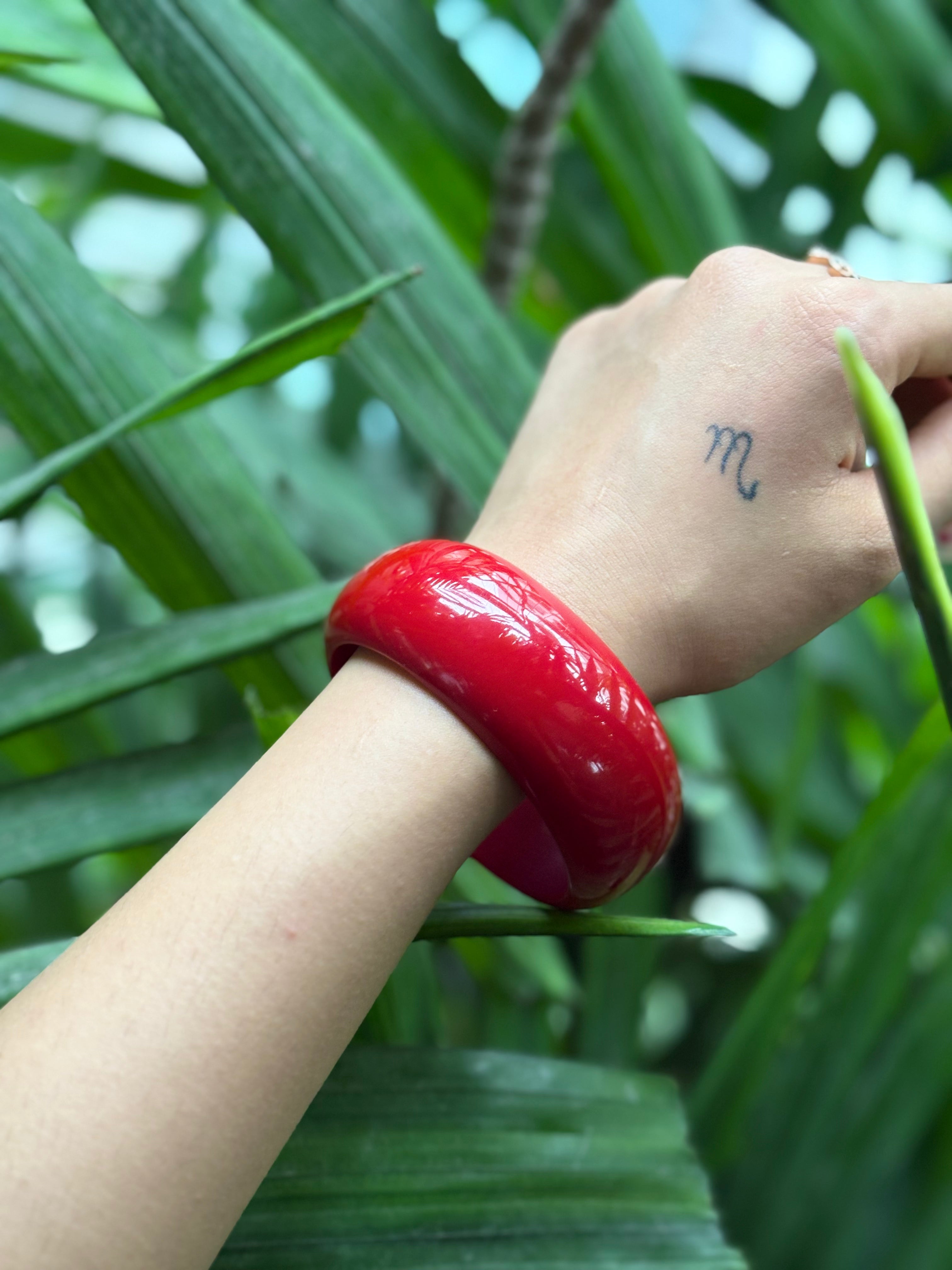 Close-up of bright red resin bangle finish