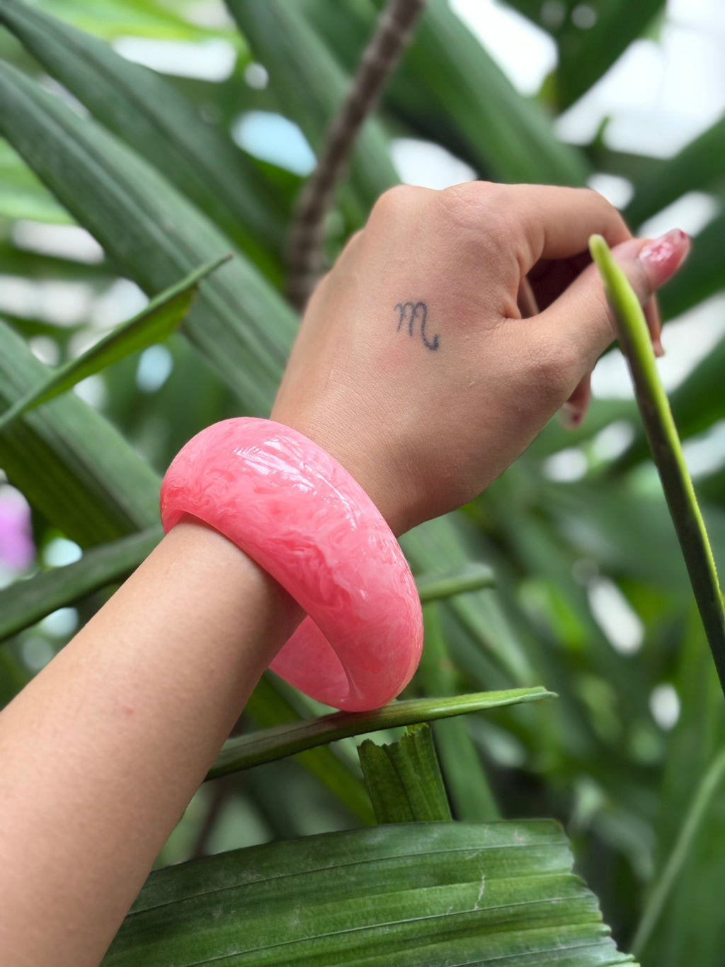 Close-up of blush pink chunky resin bangle texture
