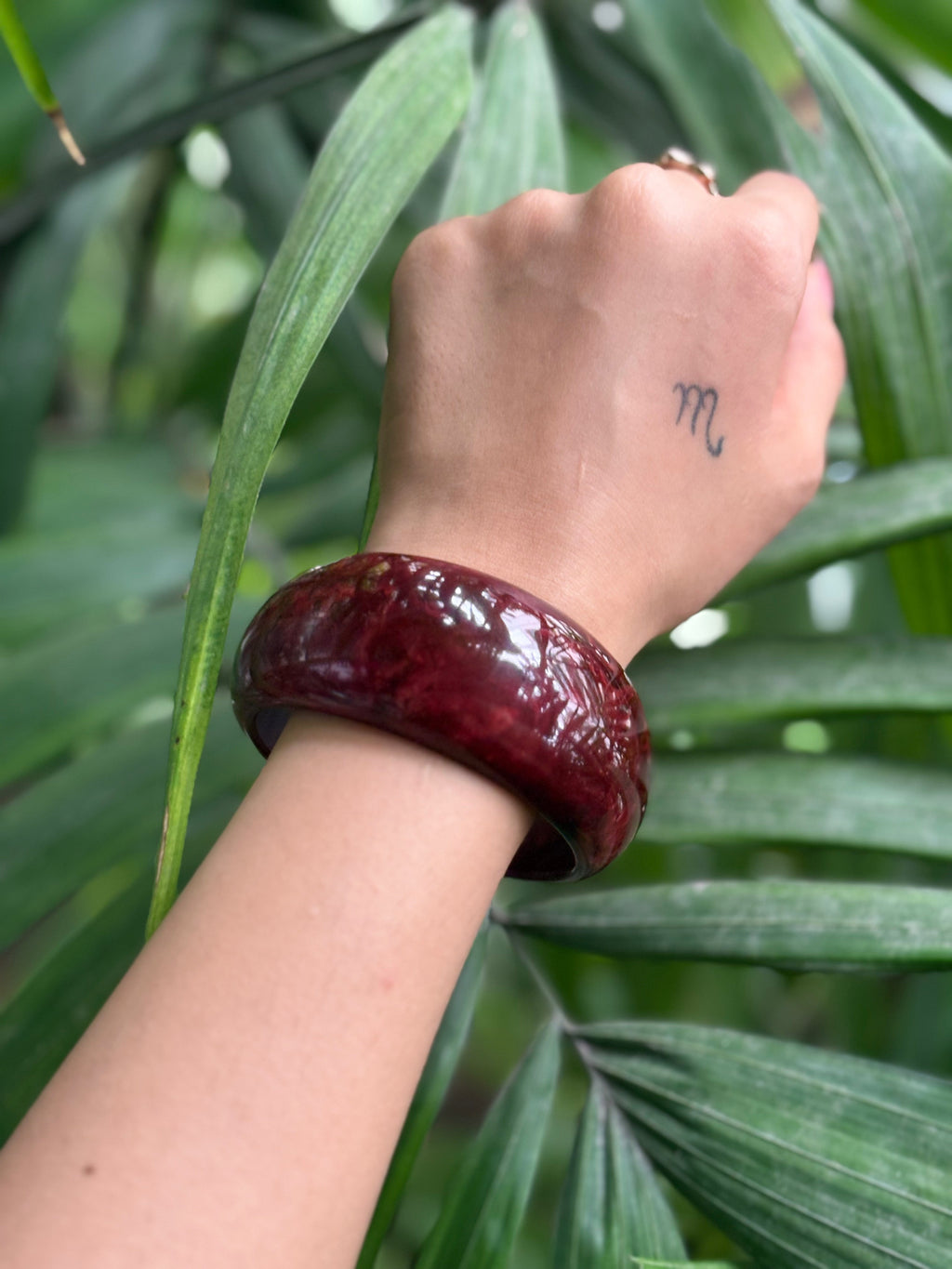 Close-up of red marbled resin bangle texture